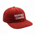 Red corduroy hat with 'Happiest Camper' embroidery, adjustable fit for comfort, showcasing style and sustainability.