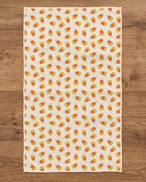 Happy Halloween waffle kitchen tea towel reverse side laid flat: candy-corn stripes on cream