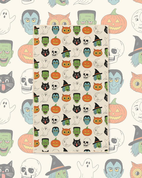 Happy Halloween Kitchen & Tea Towel with Halloween faces like witches, black cats, pumpkins and skulls on cream