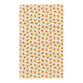Reverse side of Happy Halloween tea towel with orange and yellow candy corn pattern on cream, with Trek Light tag