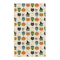 Cream Happy Halloween kitchen tea towel with vintage witches, Frankensteins, ghosts, black cats, skulls, owls, moons and