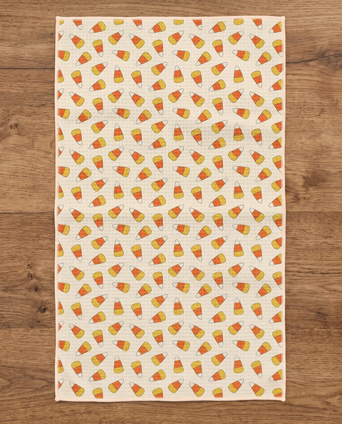 Happy Halloween waffle kitchen tea towel reverse side laid flat: candy-corn stripes on cream