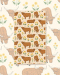 Highland Cows Kitchen & Tea Towel with brown Highland cows among yellow flowers on cream