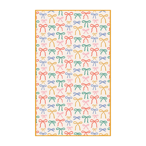 Holiday Bows Kitchen & Tea Towel with colorful bow pattern, made from 100% recycled materials for eco-friendly cleaning and quick drying.
