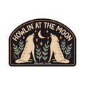 Howlin' At The Moon sticker with two wolves, made in USA, UV protected, waterproof, dishwasher safe, high-quality vinyl, 3.2x2.3 inches. By Trek Light.