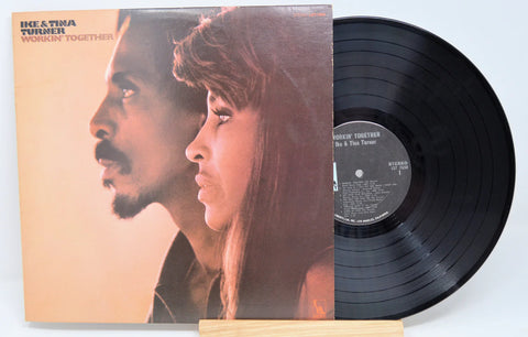 Ike and Tina Turner's 'Workin' Together' album cover featuring portraits of the duo with vinyl record.