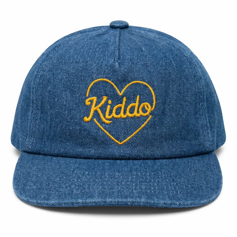 Blue denim cap with yellow "Kiddo" embroidery in heart design, perfect for stylish kids' fashion.