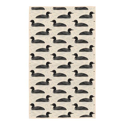 Loons kitchen tea towel with repeating black loon illustrations on cream background with wavy water lines, double-sided design