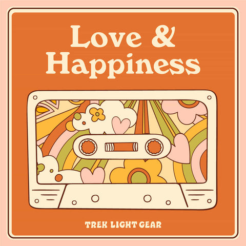 Retro cassette tape with colorful floral design and 'Love & Happiness' text, featuring Trek Light branding.