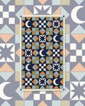 Lucky Stars Kitchen & Tea Towel with navy quilt-style geometric blocks of moons and stars in blue, peach and cream