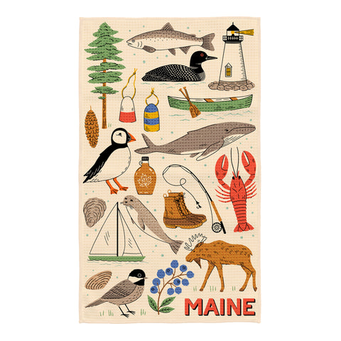 Maine kitchen towel with illustrated coastal icons including lobster, loon bird, lighthouse, sailboat, fish, and evergreen tree on cream background