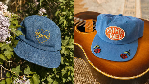 Two blue denim hats featuring embroidered designs, one reads 'Mama' and the other 'Mama Tried' with roses.