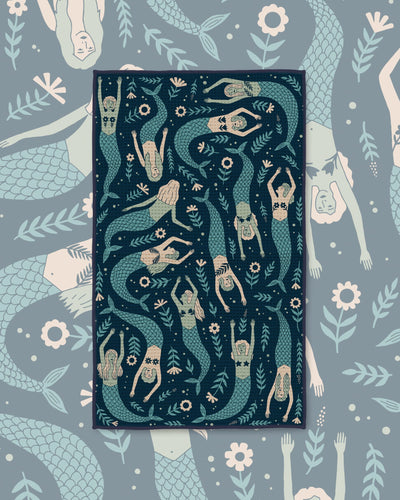 Mermaids Kitchen & Tea Towel with swimming mermaids in sage and cream on a dark navy background
