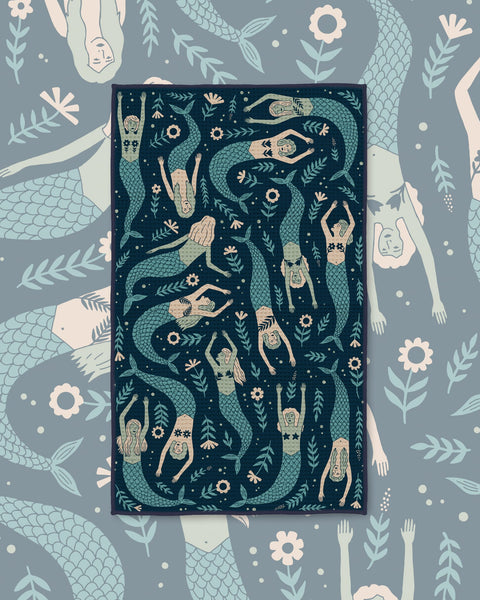 Mermaids Kitchen & Tea Towel with swimming mermaids in sage and cream on a dark navy background