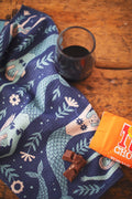 Mermaids Kitchen & Tea Towel with a glass of wine and chocolate
