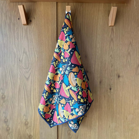 Midnight Mushroom Kitchen & Tea Towel hanging, showcasing vibrant double-sided design with eco-friendly, super absorbent Grip-Tex™ fabric.