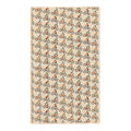 Beige waffle-textured kitchen towel covered in a repeating pattern of colorful illustrated mountain bike riders