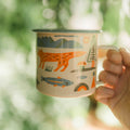 Mountain Stream Enamel Mug 16oz with colorful nature designs, perfect for cozy mornings and camping.