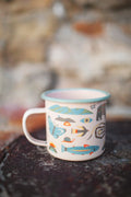 Mountain Stream Enamel Mug 16oz with colorful nature motifs, perfect for outdoor adventures or cozy mornings at home.