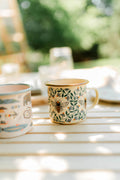 Honey Bee Enamel Mug 16oz featuring a vintage design with bees and leaves, perfect for cozy mornings and camping.