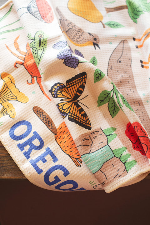 Vibrant Oregon Kitchen & Tea Towel featuring colorful designs of nature and wildlife, perfect for everyday use.