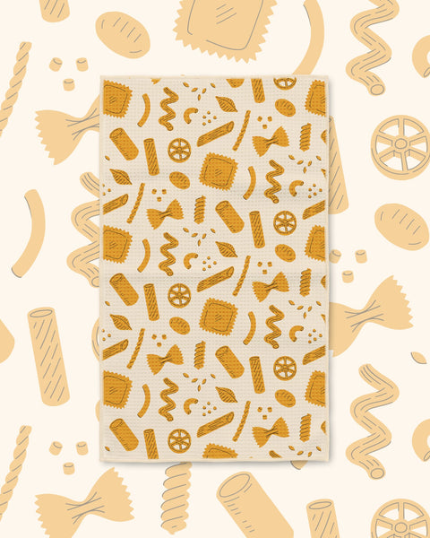 Pasta Time Kitchen & Tea Towel with golden pasta shapes on a cream background