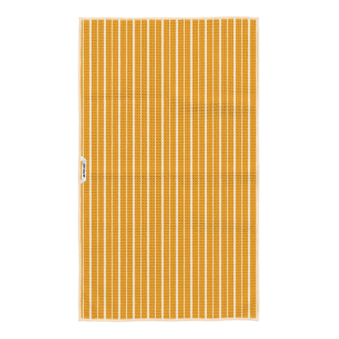 Reverse side of Pasta Time tea towel showing golden yellow and cream vertical stripes with Trek Light tag