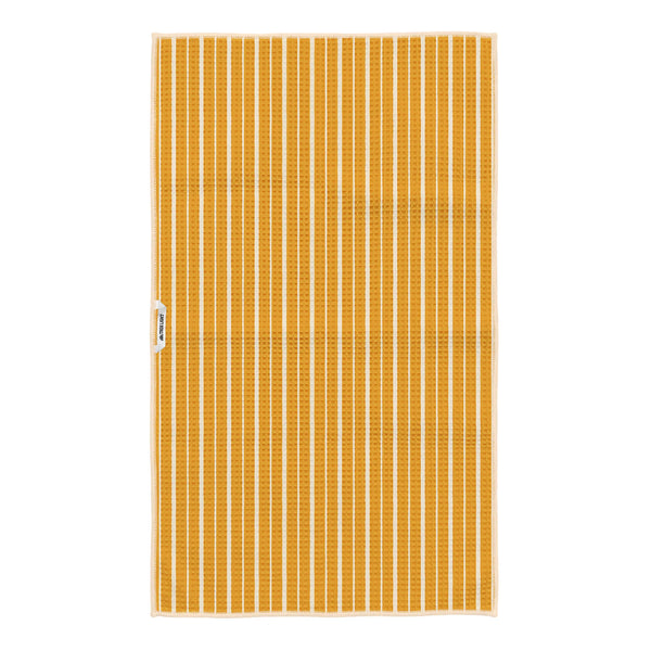 Reverse side of Pasta Time tea towel showing golden yellow and cream vertical stripes with Trek Light tag
