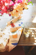 Rhode Island Kitchen & Tea Towel featuring vibrant designs of lighthouses, fish, and drink illustrations.