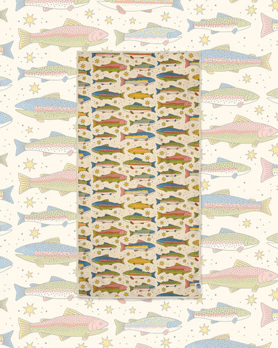 River Trout Wander & Travel Towel in cream with colorful trout and stars, on a matching larger fish print.