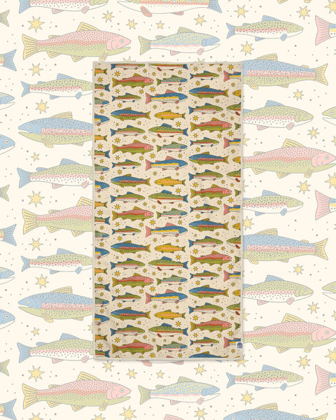 River Trout Wander & Travel Towel in cream with colorful trout and stars, on a matching larger fish print.
