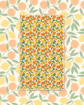 Saved By Citrus Kitchen & Tea Towel with oranges and lemons among green leaves on a cream background