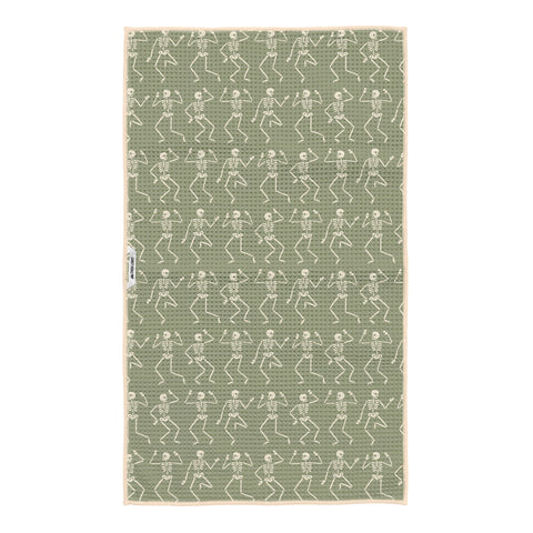 Sage green kitchen tea towel with cream dancing skeleton pattern and hanging loop