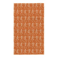 Burnt orange kitchen tea towel with cream dancing skeleton pattern and hanging loop