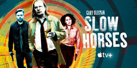 Promotional poster for 'Slow Horses' on Apple TV+ featuring three characters in front of a colorful spiral background.