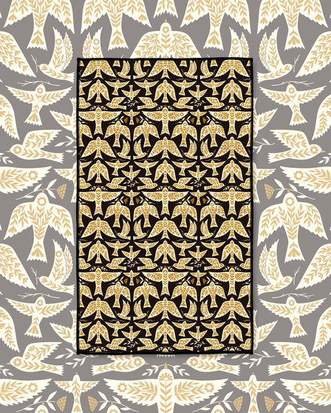 Songbird Kitchen & Tea Towel with cream-colored birds in flight on a black background