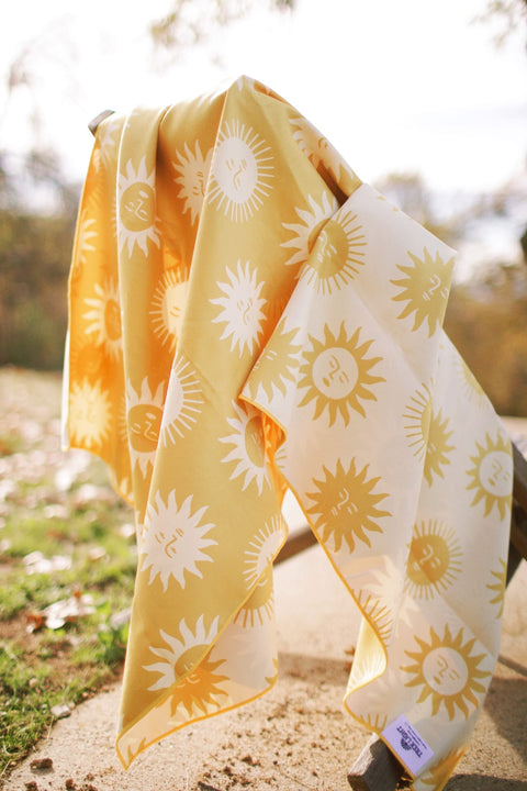 Sunny Wander & Travel Towel featuring a vibrant sunshine design, perfect for any travel adventure.