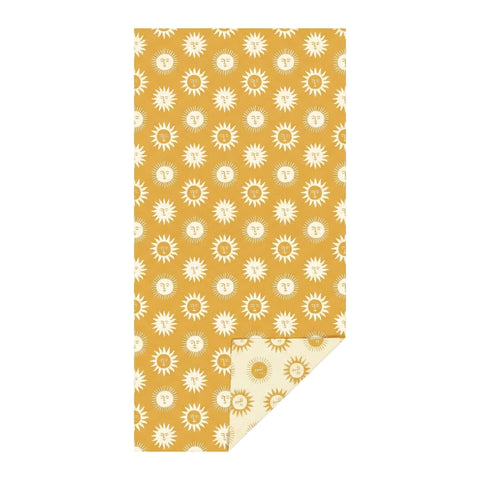 Sunny Wander & Travel Towel in yellow with sun pattern, quick-dry, sand-resistant, made from 100% recycled materials, eco-friendly.