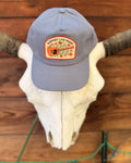 Support Live Music Hat displayed on a cow skull, featuring vibrant design and adjustable fit for everyday wear.