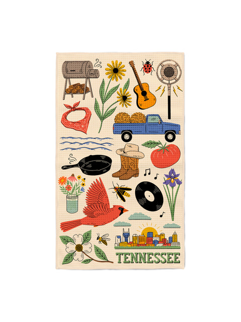 Tennessee kitchen tea towel with cardinal, guitar, cowboy boots, tomato, vinyl record and Nashville skyline on cream