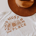 "This Must Be The Place" Trek Light shirt with brown hat, 100% ring-spun cotton, handprinted in USA, evokes favorite t-shirt feeling.