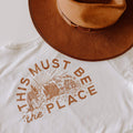 "This Must Be The Place" Trek Light shirt with brown hat, 100% ring-spun cotton, handprinted in USA, evokes favorite t-shirt feeling.