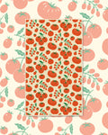 Tomato Time Kitchen & Tea Towel with red tomatoes and green vines on a cream background