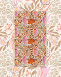 Unicorn Dreams Kitchen & Tea Towel with pink unicorns among orange flowers and brown leaves on cream