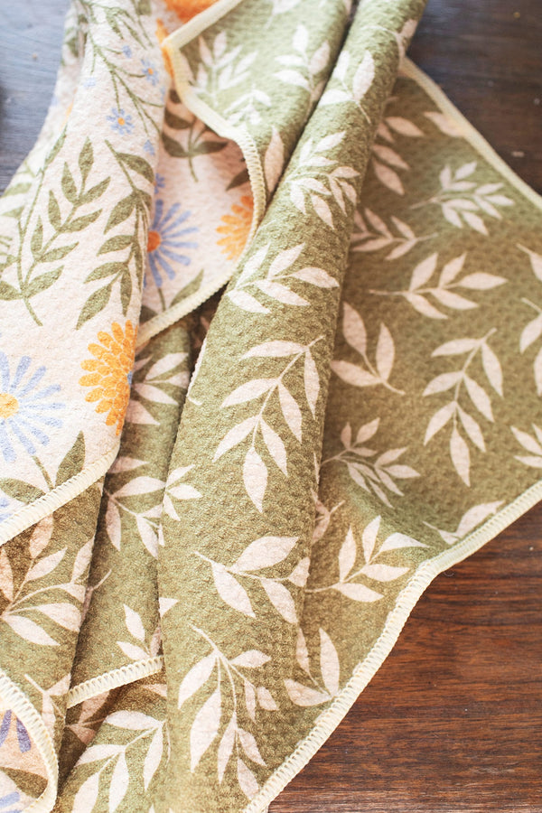 Wavy Flowers Kitchen & Tea Towel featuring vibrant floral designs and eco-friendly fabric, perfect for drying and cleaning.