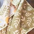 Wavy Flowers Kitchen & Tea Towel featuring vibrant floral designs and eco-friendly fabric, perfect for drying and cleaning.