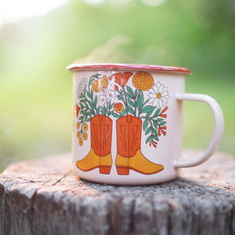 Western Bloom enamel mug 16oz with floral boot design, perfect for adventures. Durable and delightful, by Trek Light.