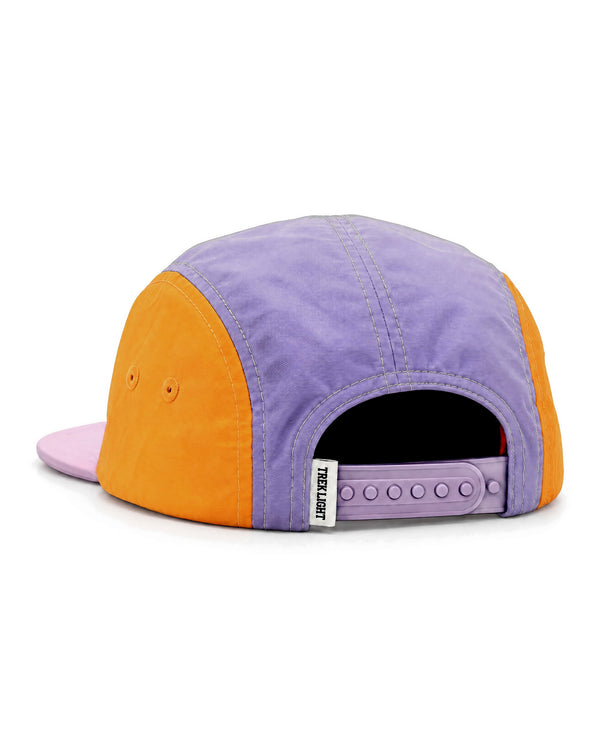 Back view of the Wild Flower Kids Hat, a five-panel cap with a purple crown, orange side panels, a pink brim and a lilac snap strap, on white.