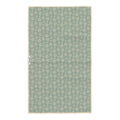 Reverse side of Winter Wonderland kitchen towel with cream snowflakes on sage green waffle-weave fabric and hanging loop
