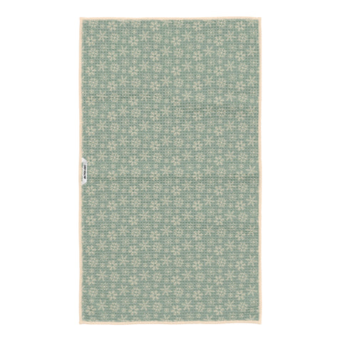 Reverse side of Winter Wonderland kitchen towel with cream snowflakes on sage green waffle-weave fabric and hanging loop